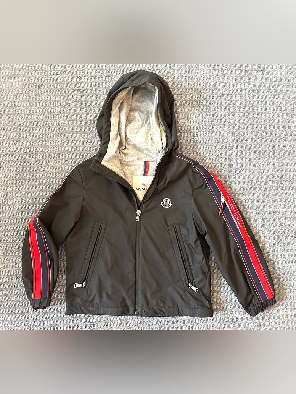 Moncler Kids Black Hooded Rain Jacket with Red and Navy Stripe